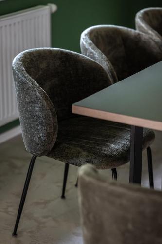 a table with two chairs and a green table at Lebe' scharnitz in Scharnitz