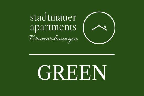 a green sign with the words skateremember apartments fertilizer administrator green at stadtmauer apartments - Neue helle Studio Wohnung direkt an der historischen Stadtmauer in Nördlingen