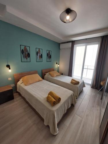 Postel nebo postele na pokoji v ubytování Serenity Apartment