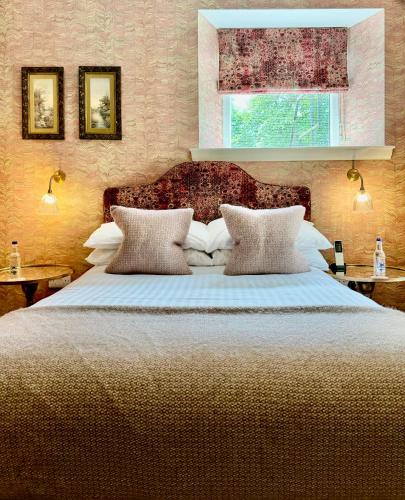 Ένα ή περισσότερα κρεβάτια σε δωμάτιο στο Glenfinnan House Hotel