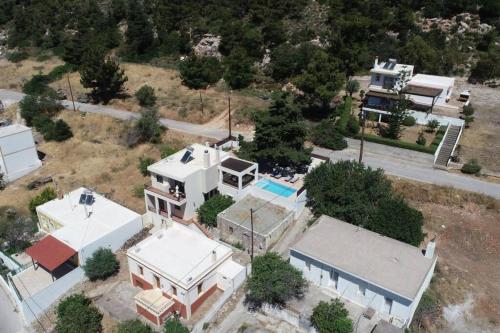 an aerial view of a large white house at Hara House in Monolithos Rhodes in Monólithos