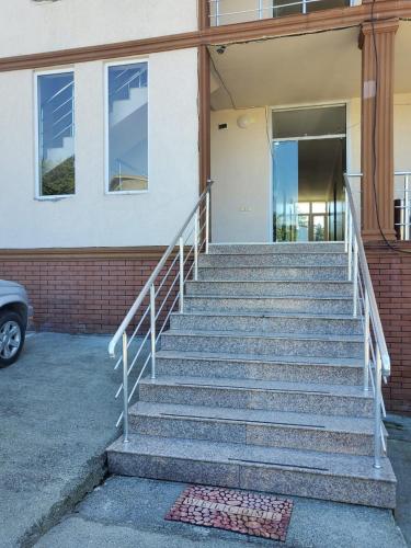 a set of stairs in front of a building at Batumi Aparthotel 22D in Batumi