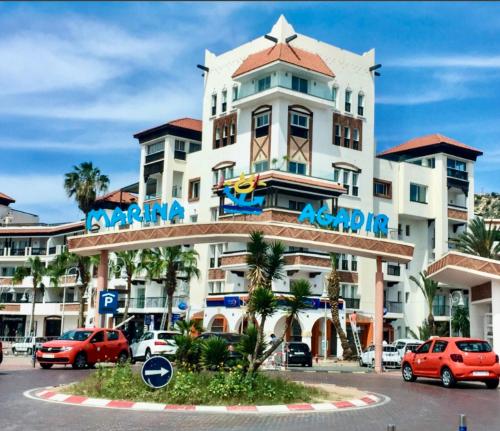 a large white building with a sign on it at Unforgettable views of Marina Agadir in Agadir