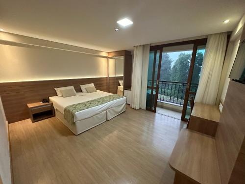 Giường trong phòng chung tại Vista Azul Hotel - Pedra Azul