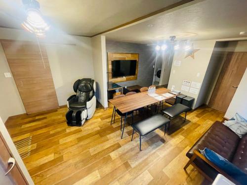 an overhead view of a living room with a table and chairs at Sofil 函館First in Hakodate