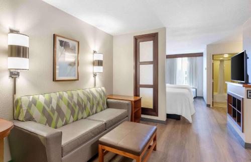 a hotel room with a couch and a bed at Extended Stay America Premier Suites - Pittsburgh - Cranberry Township - I-76 in Cranberry Township