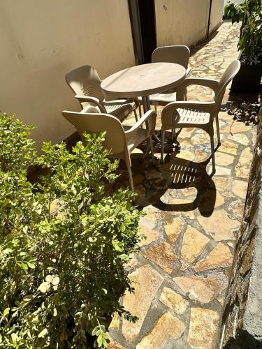a table and chairs sitting on a stone patio at Hostel Leon in Berat
