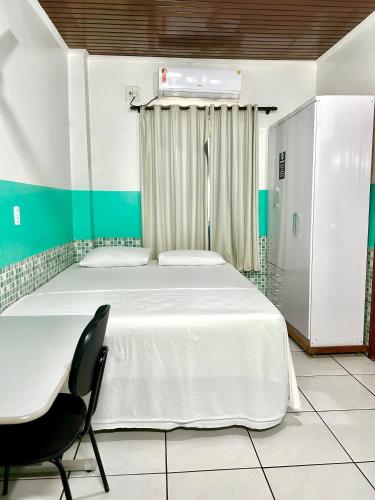 Ένα ή περισσότερα κρεβάτια σε δωμάτιο στο Hotel Maracá