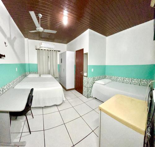 Ένα ή περισσότερα κρεβάτια σε δωμάτιο στο Hotel Maracá