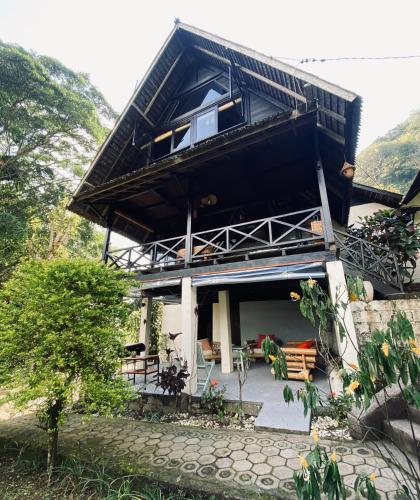 a house with a view of the front of it at Lakeside retreat and Golf in Bedugul in Bedugul