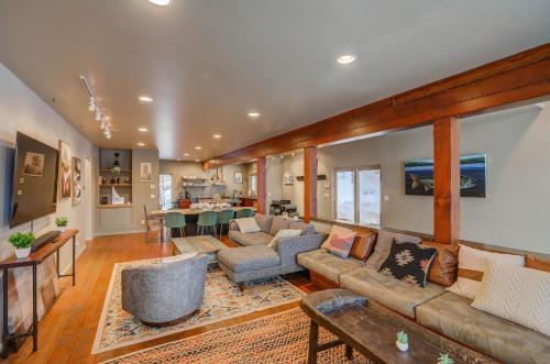 a large living room with couches and a table at Mackinaw Manor by Casago McCall - Donerightmanagement in McCall