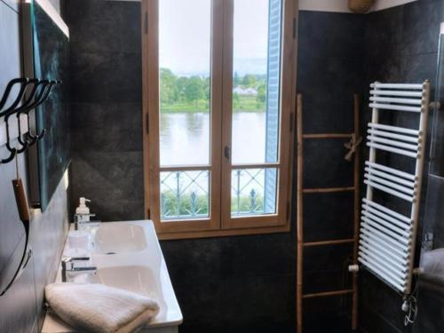 a bathroom with a sink and a window at Maison de Charme avec Terrasse et Animaux Acceptés à Moulins - FR-1-489-532 in Moulins