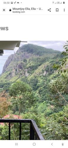 a view of a mountain with trees and the ocean at Ella floating view in Ella