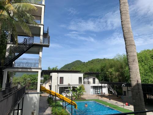 a view from the balcony of a resort with a swimming pool at Adventure Dome Resort in Kep
