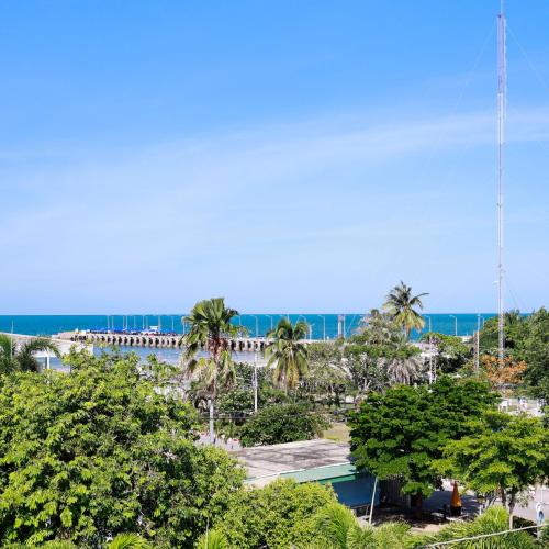 a view of a beach with palm trees and the ocean at Huahin Place Guest House in Hua Hin