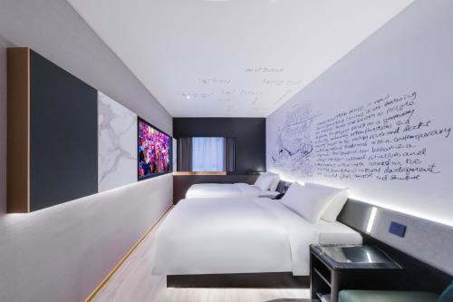 Postel nebo postele na pokoji v ubytování CitiGO Hotel Yuexiu Ouzhuang MTR Station Ghuangzhou - Free shuttle between hotel and Exhibition Center during Canton Fair