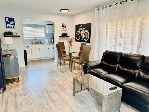 a living room with a couch and a table at Walk To Americana on Brand. in Glendale