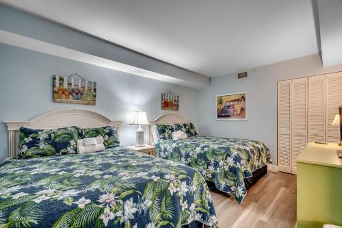 Ένα ή περισσότερα κρεβάτια σε δωμάτιο στο Oceanfront 2 bedroom Condo on Cam 2nd Floor