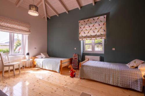 Ένα ή περισσότερα κρεβάτια σε δωμάτιο στο Oasis Home