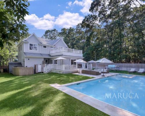 a large white house with a swimming pool in the yard at Villa KeyLime in Sag Harbor