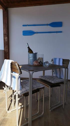 a table with two chairs and a table with at Poril in Gran Tarajal