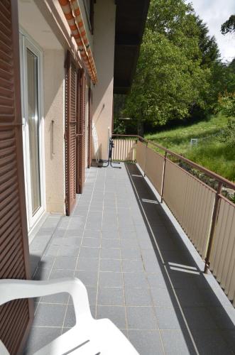 a balcony with a bench on the side of a building at Grosse, schöne Wohnung im Grünen in Brig
