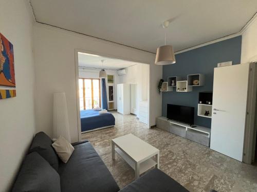 a living room with a couch and a bed at Balcony House in Naples