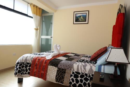 Ein Bett oder Betten in einem Zimmer der Unterkunft INTI SUMAQ WASI