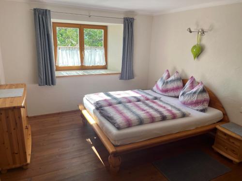 A bed or beds in a room at Landhaus Ganzer