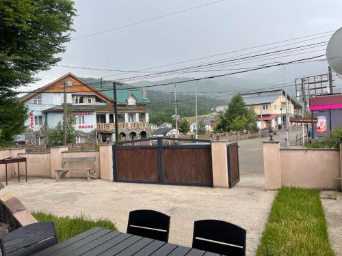 a park with a wooden gate in a city at Villa Astoria Bakuriani in Bakuriani