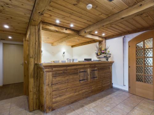a large room with a wooden bar in a house at Bergblick Lodge - 3 Sterne Garni - Neueröffnung in Aeschi