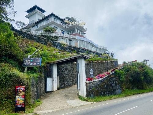 a large house on the side of a hill at Grand Glorious in Haputale