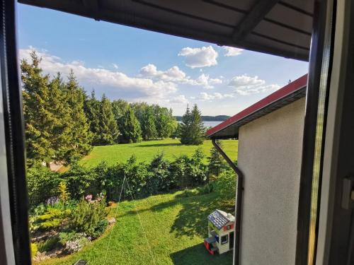 a view of a yard from a window at Ośrodek Wypoczynkowy "U Kulasa" in Warchały