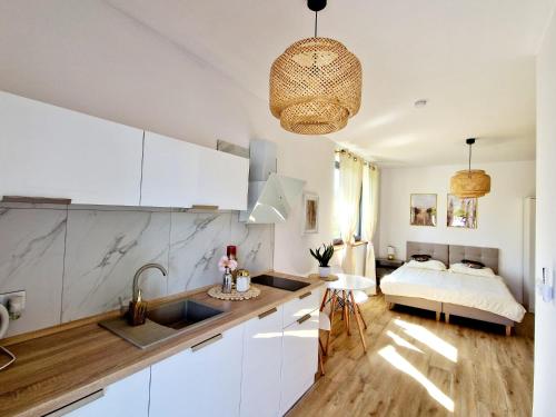 Ένα ή περισσότερα κρεβάτια σε δωμάτιο στο Apartament Amelia2