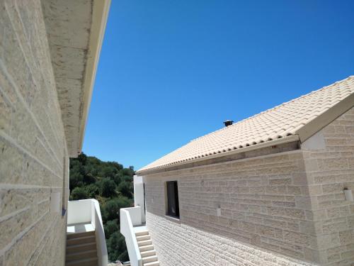 a view from the side of a building at LefkoParga Luxury Suites in Parga