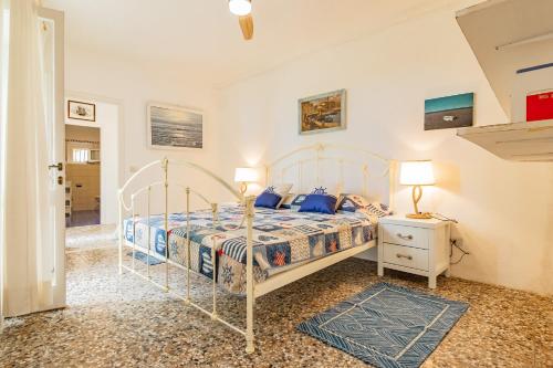 Postel nebo postele na pokoji v ubytování Tenuta Bussadori - Dimora Del Corsaro