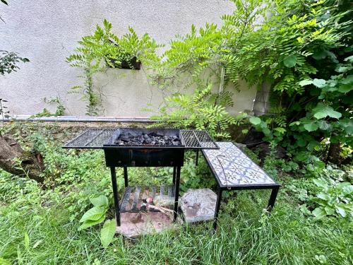 a table and a bench in a garden at ❆cozy, 4 BR. Villa in Ananuri❆ in Ananuri