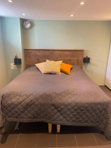 a bed with two pillows on it in a bedroom at Modern villa i Sävedalen in Gothenburg
