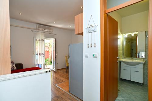 a kitchen with a refrigerator and a sink at Apartments Magdalena 759 in Valbandon