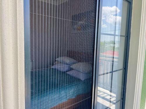 a glass window of a building with pillows at Luxury Villa in Ismayilli in İsmayıllı