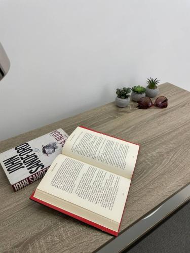 a book sitting on top of a wooden table at Casetta Amati in Nettuno