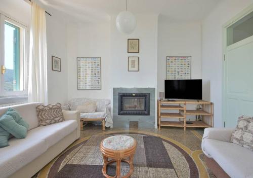 a living room with a couch and a fireplace at Andromeda Flexyrent in Rapallo