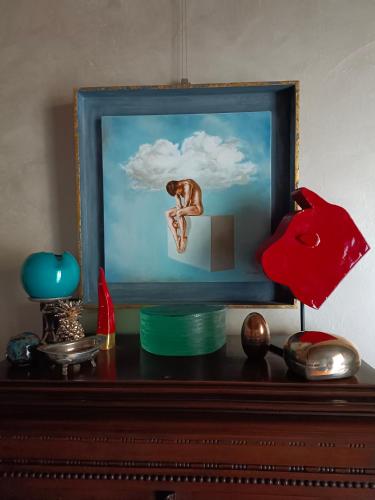 a picture of a man sitting on top of a dresser at Magnifico appartamento @Turin in Turin