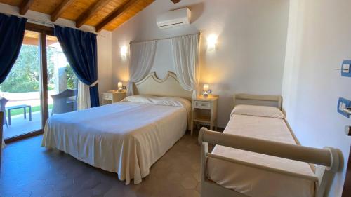 Postel nebo postele na pokoji v ubytování Le Anfore Hotel