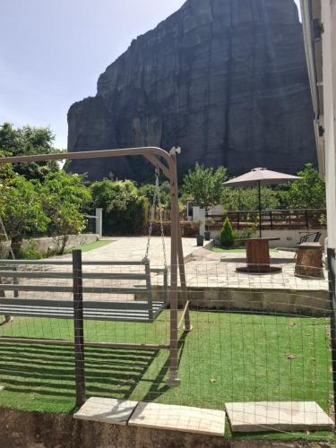 a swing with a mountain in the background at Paradise of Meteora B in Kastrákion