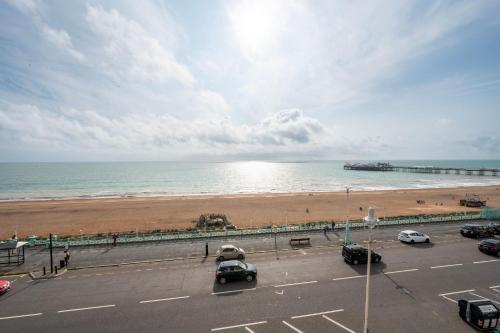 a parking lot next to a beach with a pier at The Lanes Hotel in Brighton & Hove