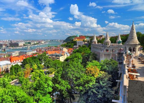 an aerial view of a city with trees and a castle at Verdi Budapest Aquincum in Budapest