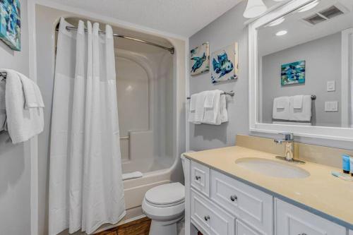 a bathroom with a shower and a toilet and a sink at Pristine Oceanfront King Suite Best Layout in Bldg 806 in Myrtle Beach