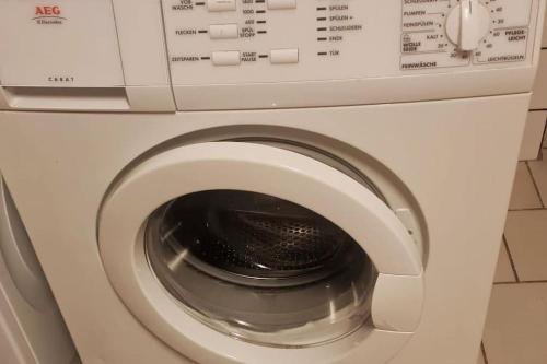 a close up of a washing machine at Moderne, ruhige Ferienwohnung! in Geistingen
