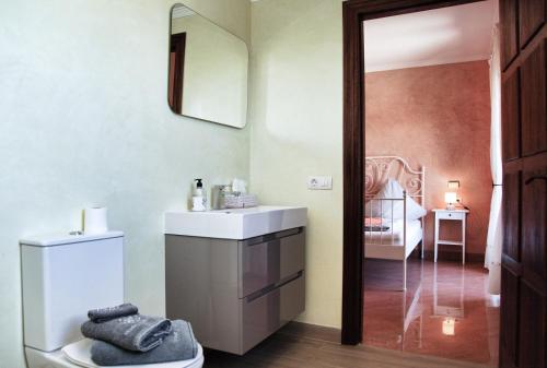 a bathroom with a sink and a mirror at Finca Leilani in Llucmajor